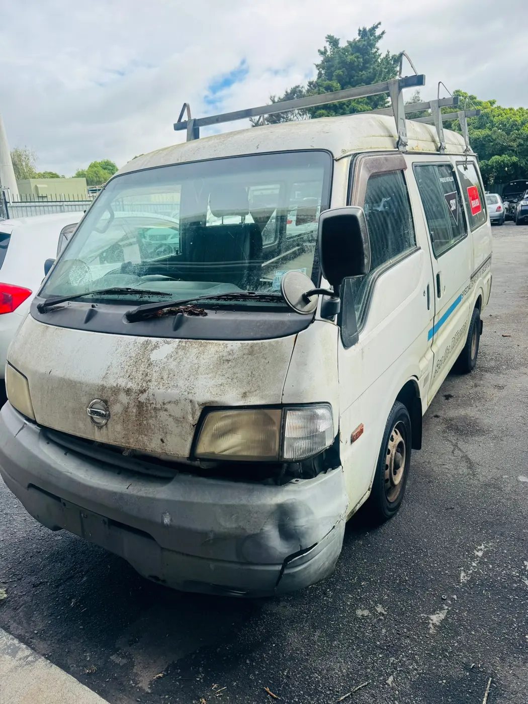 Mud-stained Nissan van ready for scrap collection