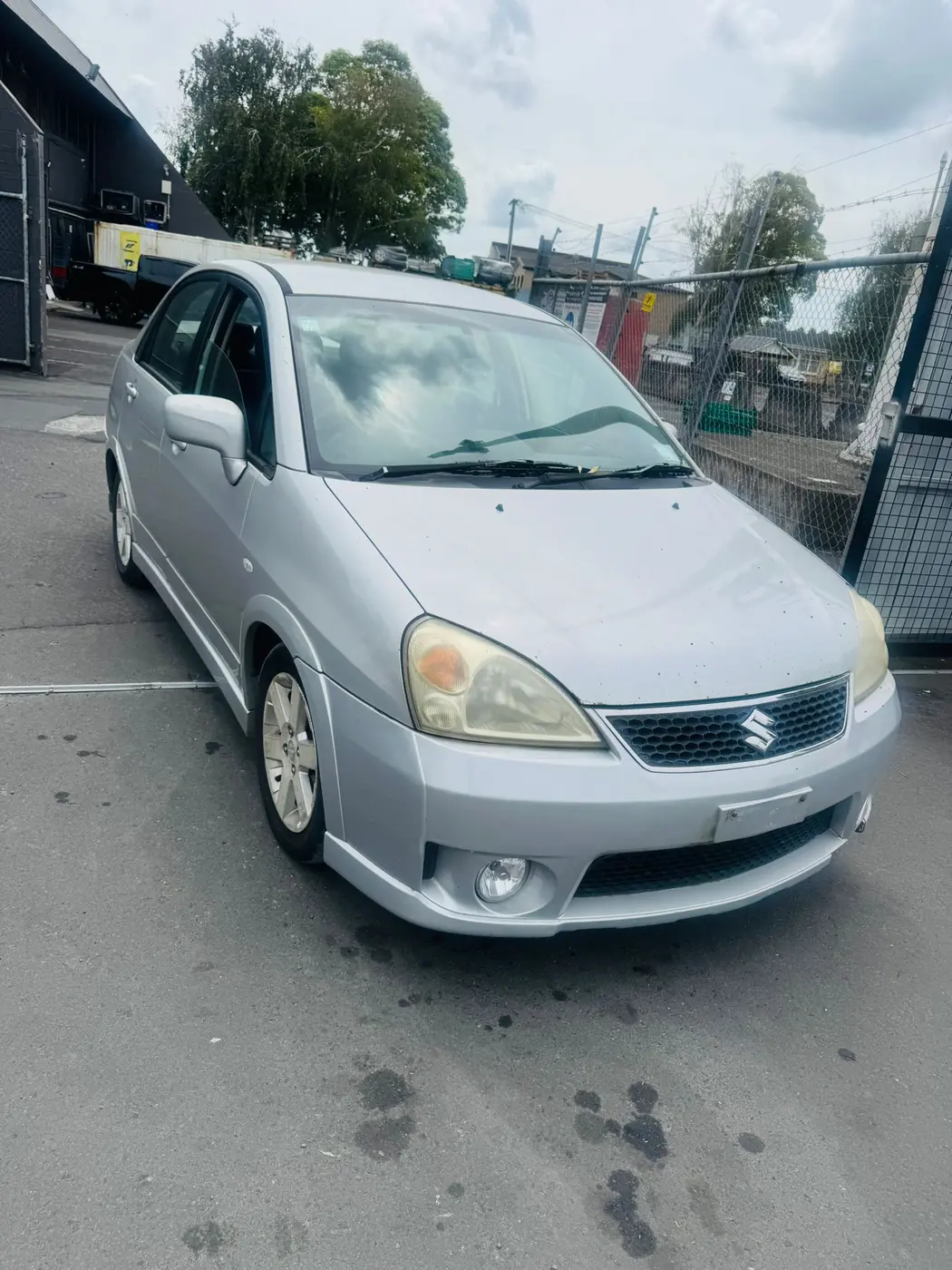 Old silver Suzuki hatchback